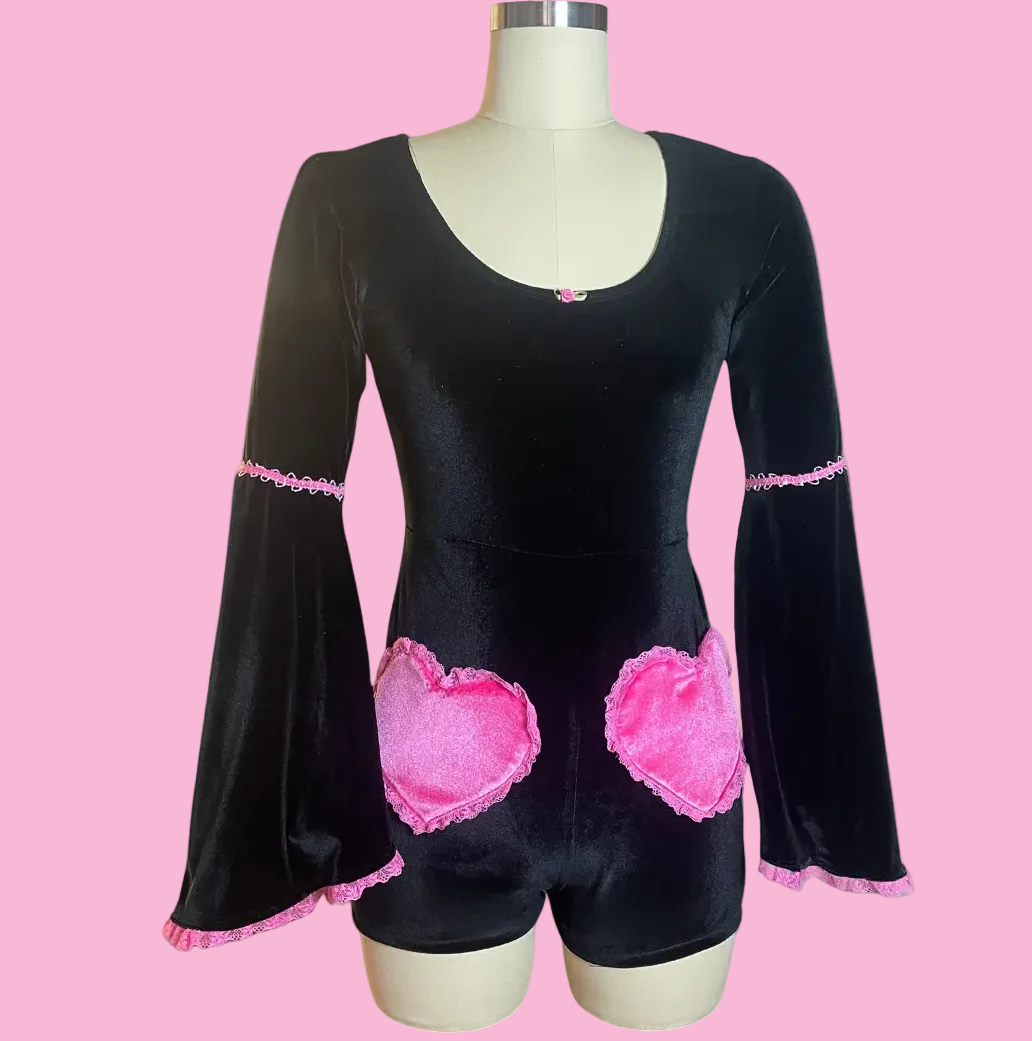 Black outfit with pink heartshaped pockets